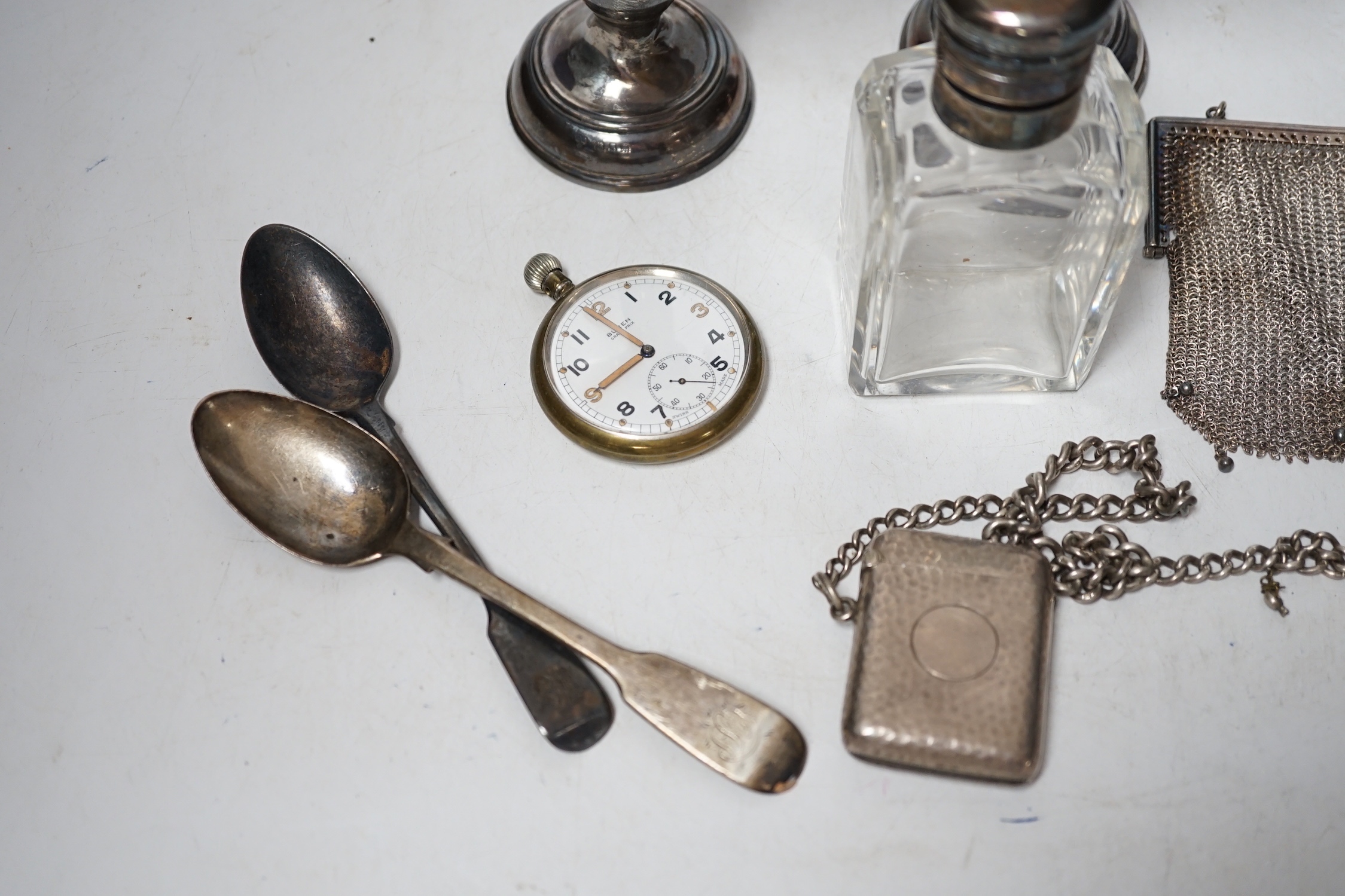 A matched pair of George V silver mounted posy vases, 16.3cm, together with a silver topped toilet jar, silver vesta case on a silver albert, a silver mesh evening bag, two silver spoons and a base metal pocket watch.